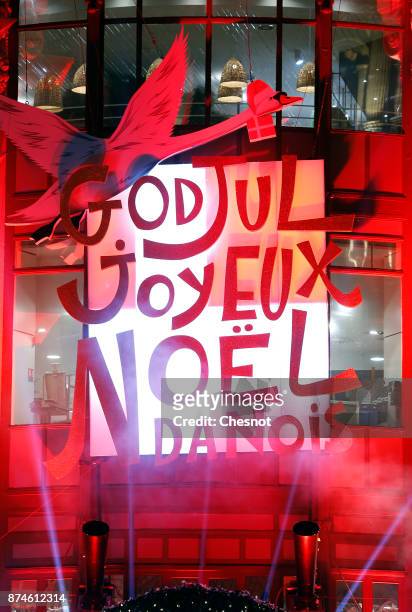 Words merry christmas are displayed in french and danish on the illuminated facade of the BHV Marais department store after the inauguration of the...