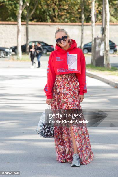 Fashion stylist Charlotte Sandgren wears a Muf10 hoodie, Ba&sh dress, Saks Potts bag, Asics trainers and Fendi sunglasses day 4 of Paris Womens...
