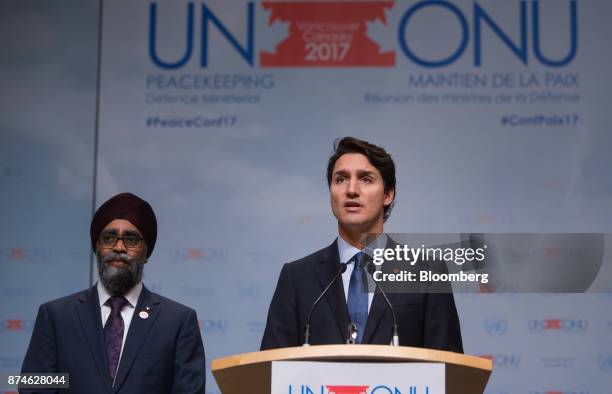 Justin Trudeau, Canada's prime minister, right, speaks as Harjit Sajjan, Canada's defense minister, listens during the 2017 UN Peacekeeping Defence...