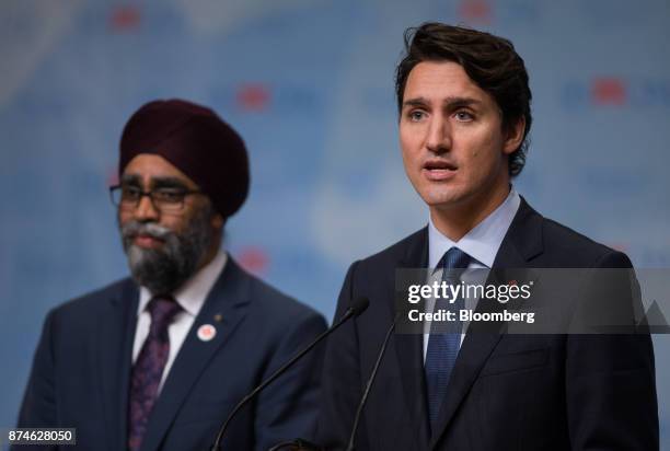 Justin Trudeau, Canada's prime minister, right, speaks as Harjit Sajjan, Canada's defense minister, listens during the 2017 UN Peacekeeping Defence...