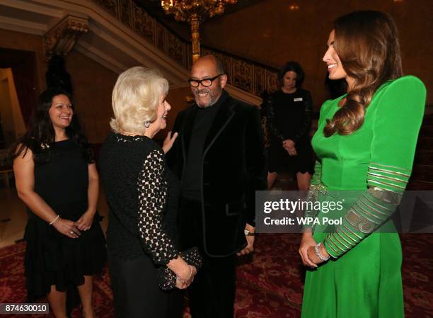 Bruce Oldfield is greeted by Camilla, Duchess of Cornwall during the Bruce Oldfield Fashion Show at Lancaster House in support of the National...