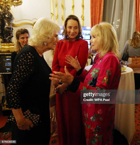 Camilla, Duchess of Cornwall speaks to actress Susan Hampshire during the Bruce Oldfield Fashion Show at Lancaster House in support of the National...