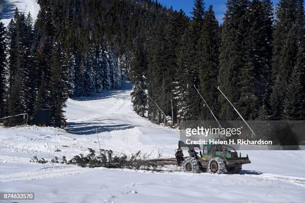Skidder pulls cut trees off of Eldora mountain as crews work hard before opening day at Eldora ski area on November 9, 2017 in Nederland, Colorado....