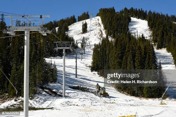 Skidder pulls cut trees off of Eldora mountain as crews work hard before opening day at Eldora ski area on November 9, 2017 in Nederland, Colorado....