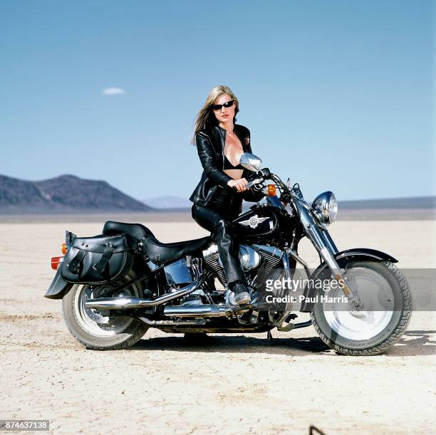 Mary Anne Hobbs a BBC Radio One presenter whilst filming a BBC Television documentary on Motorcycling throughout the World, here on a Harley Davidson...