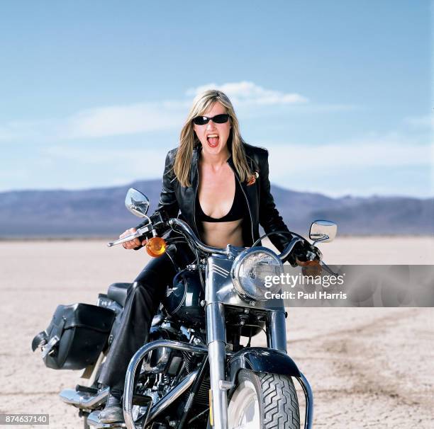 Mary Anne Hobbs a BBC Radio One presenter whilst filming a BBC Television documentary on Motorcycling throughout the World, here on a Harley Davidson...