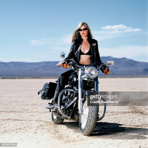 Mary Anne Hobbs a BBC Radio One presenter whilst filming a BBC Television documentary on Motorcycling throughout the World, here on a Harley Davidson...