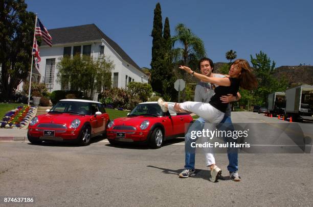English model/actress Amanda Pays and English software engineer Marcus Edwardes with their new BMW Mini Coopers April 29, 2002. In Glendale, Los...