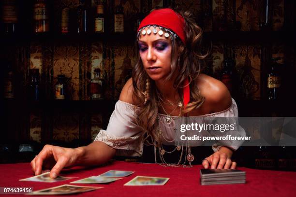 gypsy reading tarot cards - fortune teller table stock pictures, royalty-free photos & images