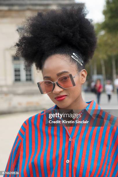 Barneys social media manager and editor Candace Marie wears a Marimekko shirt, Calvin Klein sunglasses day 4 of Paris Womens Fashion Week...