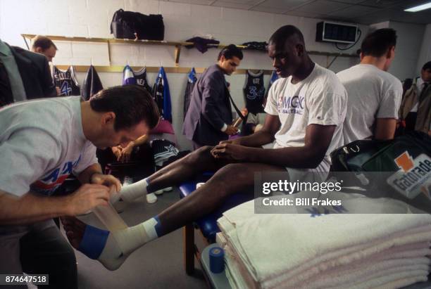 Orlando Magic center Shaquille O'Neal getting feet wrapped by team trainer before game vs New York Knicks at Madison Square Garden.. New York, NY...