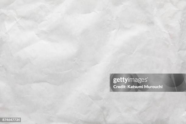 wrinkled white paper texture background - paper wrinkled stock-fotos und bilder