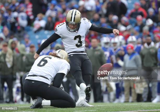 Wil Lutz of the New Orleans Saints kicks a PATD during NFL game action against the Buffalo Bills at New Era Field on November 12, 2017 in Buffalo,...