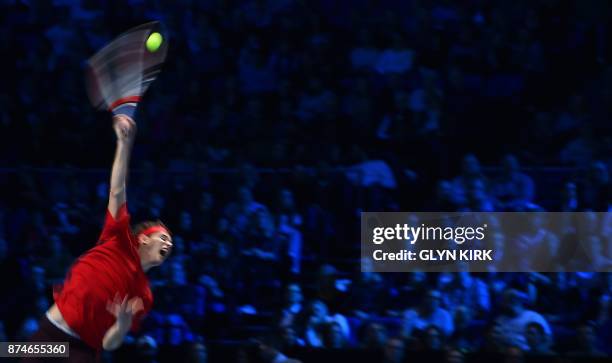 Austria's Dominic Thiem serves to Spain's Pablo Carreno Busta during their men's singles round-robin match on day four of the ATP World Tour Finals...