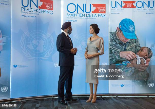 Harjit Sajjan, Canada's defense minister, left, speaks with actress Angelina Jolie, special envoy to the United Nations High Commissioner for...
