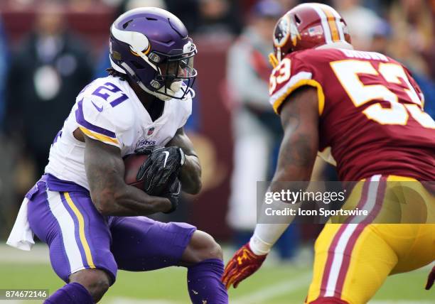 Minnesota Vikings running back Jerick McKinnon looks for some running room around Washington Redskins inside linebacker Zach Brown during a match...