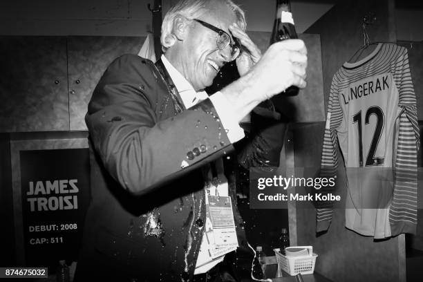 David Gallop is sprayed with beers as Australia celebrate victory in the change rooms after winning the 2018 FIFA World Cup Qualifiers Leg 2 match...
