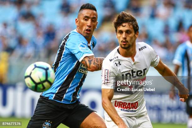 Lucas Barrios of Gremio battles for the ball against Rodrigo Caio of Sao Paulo during the match between Gremio and Sao Paulo as part of the...