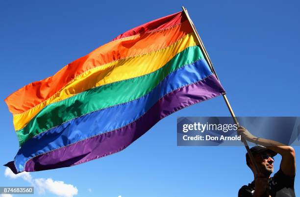 Prominent Sydney artist Chris Lewis proudly flies his much loved Rainbow flag on November 15, 2017 in Sydney, Australia. Australians have voted for...