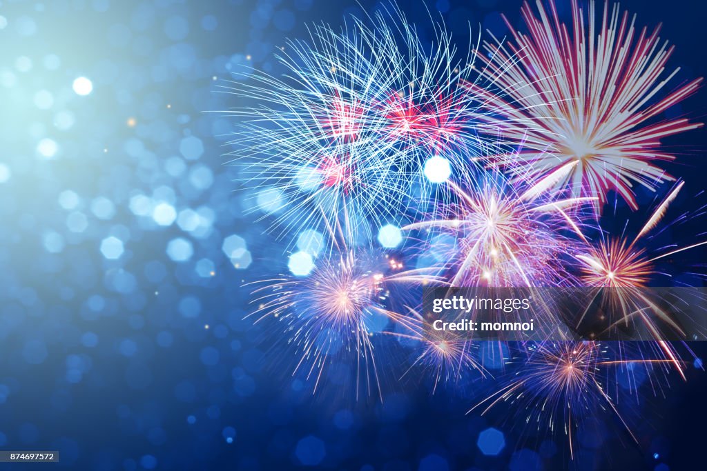 Abstract fireworks celebration on bokeh festive light background