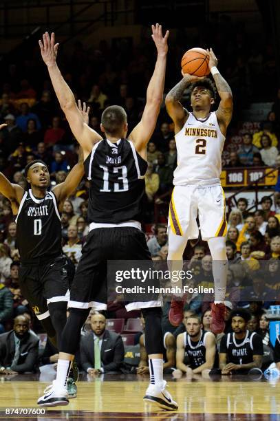 Nate Mason of the Minnesota Golden Gophers shoots the ball against Carson Smith of the USC Upstate Spartans during the game on November 10, 2017 at...