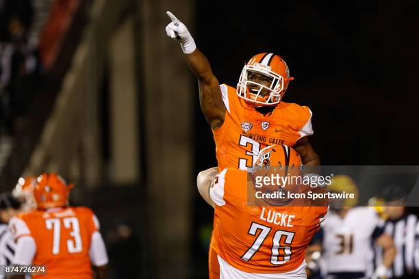Bowling Green Falcons running back Andrew Clair is lifted into the air by Bowling Green Falcons offensive lineman Andrew Lucke after scoring a...