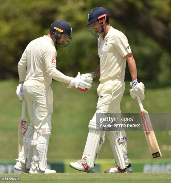 England opener Alastair Cook celebrates his 50 against Cricket Australia XI with batting partner Mark Stoneman on the second day of a four-day Ashes...