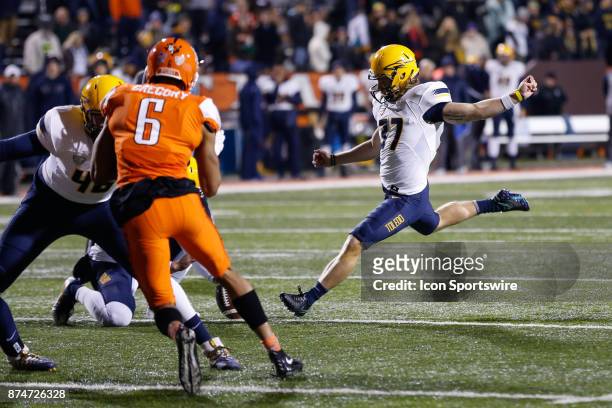 Toledo Rockets kicker Jameson Vest kicks an extra point during first half game action between the Toledo Rockets and the Bowling Green Falcons on...
