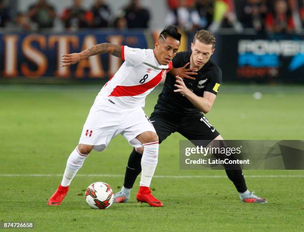 Christian Cueva of Peru and Jeremy Brockie of New Zealand fight for the ball during the second leg match between Peru and New Zealand as part of the...