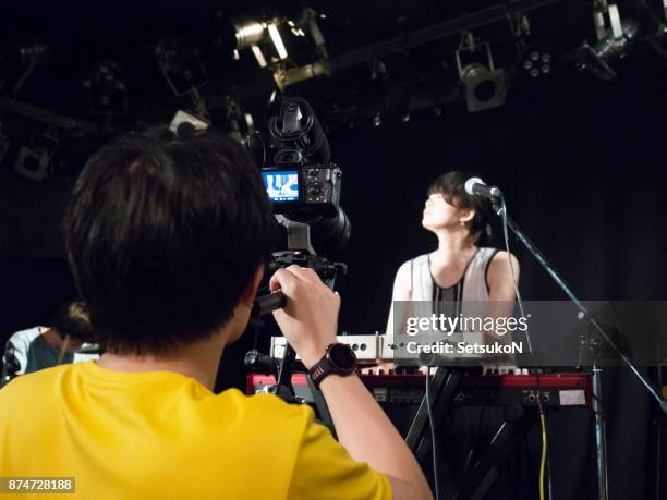 man shooting music video, keyboad player. - entertainment occupation stock pictures, royalty-free photos & images