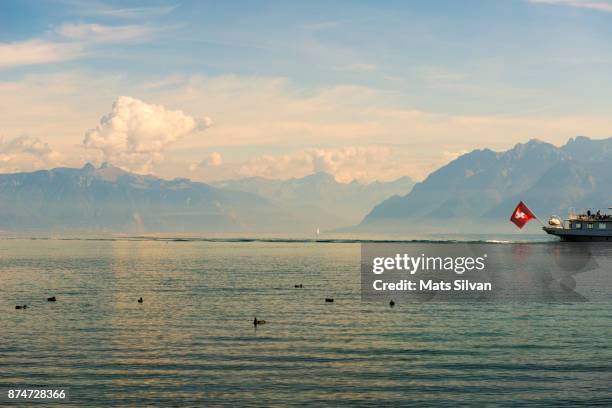 passenger ship with swiss flag on lake geneva - paddleboat stock pictures, royalty-free photos & images