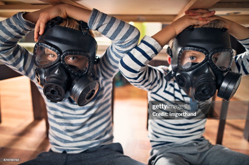 Two kids hiding under table during NBC attack