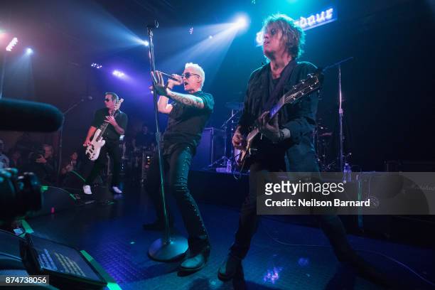 Robert DeLeo, Jeff Gutt, and Dean DeLeo of Stone Temple Pilots performs onstage during SiriusXM Presents Stone Temple Pilots Live from the Troubadour...