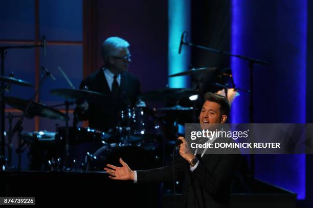 Singer Michael Bublé performs during the Library of Congress Gershwin Prize Honorees Tribute Concert in Washington, DC on November 15, 2017. / AFP...