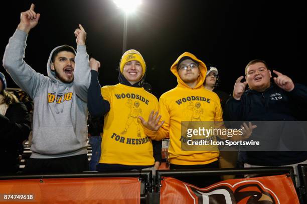 Toledo fans wearing "Woodside for Heisman" t-shirts cheer during second half game action between the Toledo Rockets and the Bowling Green Falcons on...