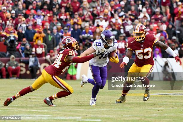 Minnesota Vikings wide receiver Adam Thielen in action against Washington Redskins cornerback Josh Norman and inside linebacker Zach Brown on...