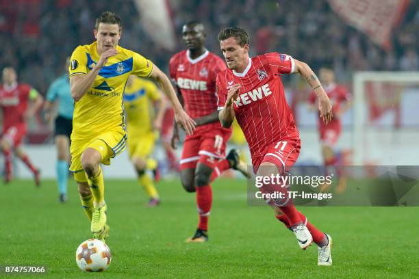 Evgeni Yablonski of BATE Borisov and Simon Zoller of Koeln battle for the ball during the UEFA Europa League group H match between 1. FC Koeln and...