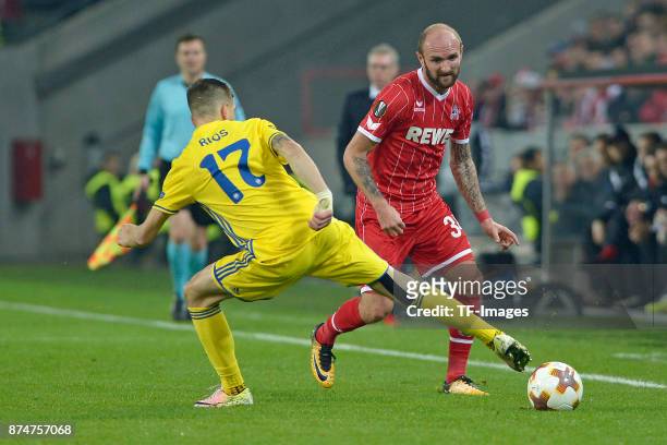 Aleksei Rios of BATE Borisov and Konstantin Rausch of Koeln battle for the ball during the UEFA Europa League group H match between 1. FC Koeln and...