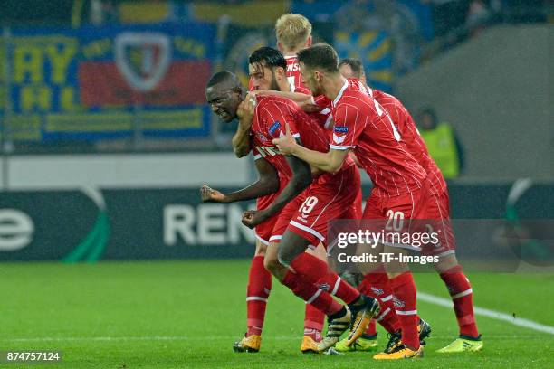 Sehrou Guirassy of Koeln celebrates after scoring his team`s third goal with team mates during the UEFA Europa League group H match between 1. FC...