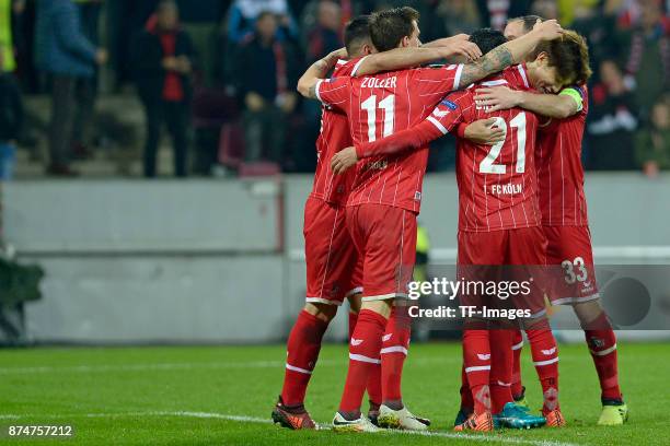 Yuya Osako of Koeln celebrates after scoring his team`s fourth goal with team mates during the UEFA Europa League group H match between 1. FC Koeln...