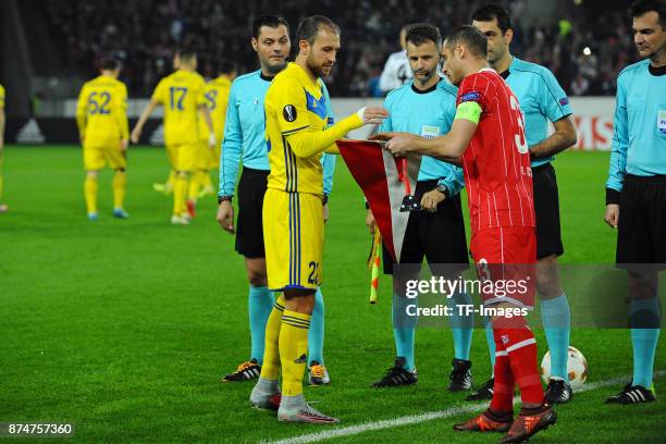 Igor Stasevich of BATE Borisov exchanges pennants with Matthias Lehmann of Koeln during the UEFA Europa League group H match between 1. FC Koeln and...