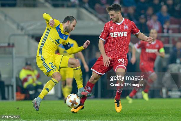 Igor Stasevich of BATE Borisov and Salih Oezcan of Koeln battle for the ball during the UEFA Europa League group H match between 1. FC Koeln and BATE...