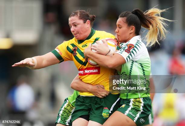 Stephanie Hancock of Australia is tackled during the 2017 Women's Rugby League World Cup match between Australia and Cook Islands at Southern Cross...