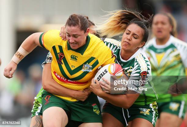 Stephanie Hancock of Australia is tackled during the 2017 Women's Rugby League World Cup match between Australia and Cook Islands at Southern Cross...