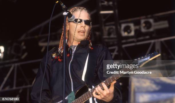 American singer Dexter Holland of Offspring performs on stage, United Kingdom, circa 1995.