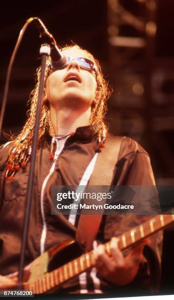 American singer Dexter Holland of Offspring performs on stage, United Kingdom, circa 1995.