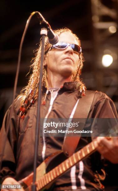 American singer Dexter Holland of Offspring performs on stage, United Kingdom, circa 1995.