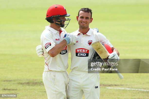 Callum Ferguson of South Australia congratulates Jake Weatherald of South Australia after scoring his century during day four of the Sheffield Shield...