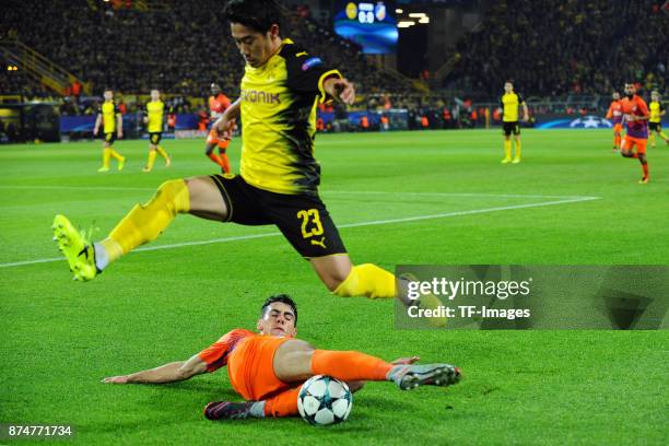 Praksitelis Vouros of Nikosia and Shinji Kagawa of Dortmund battle for the ball during the UEFA Champions League Group H soccer match between...