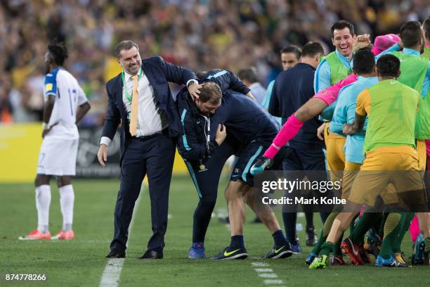 Australia Coach Ange Postecoglou and Australian bench players and staff celebrate a goal during the 2018 FIFA World Cup Qualifiers Leg 2 match...